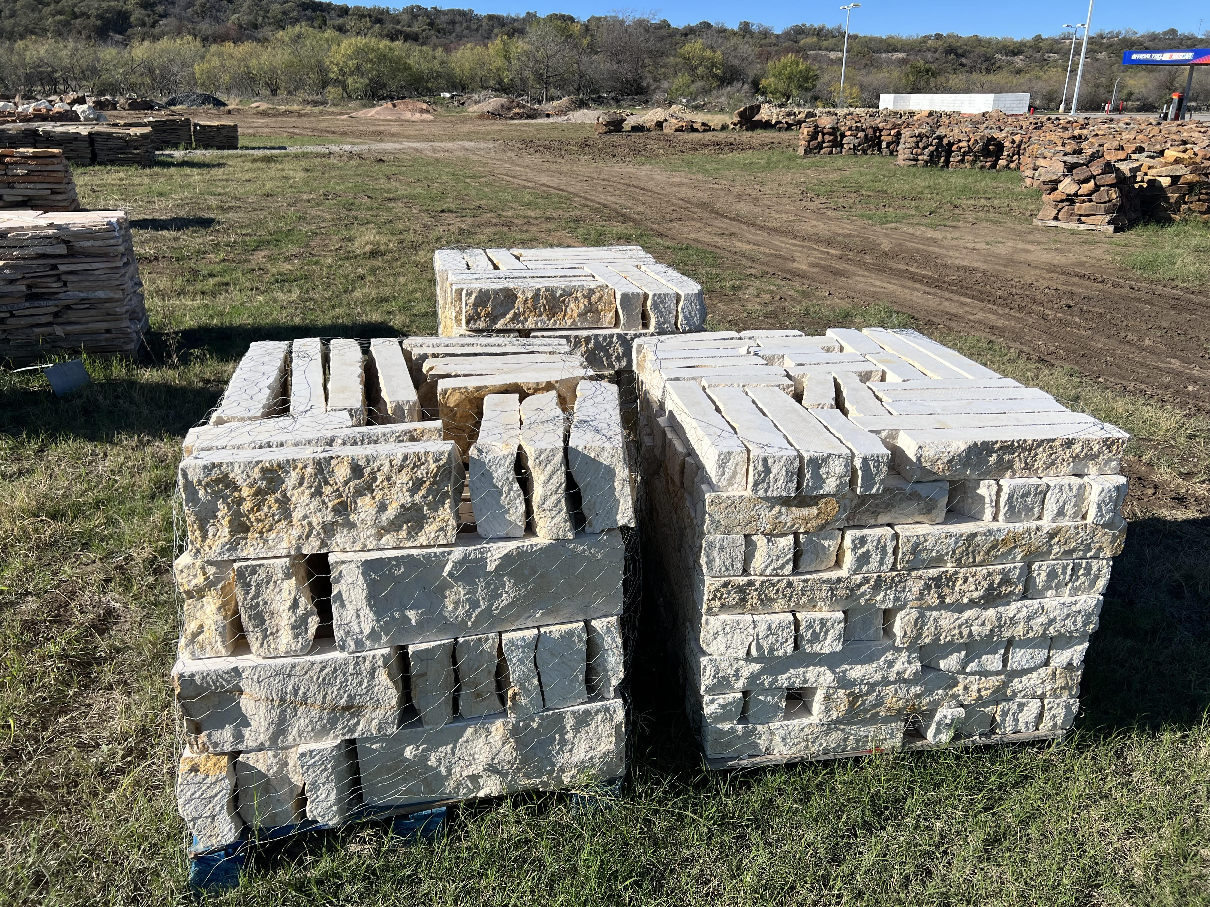 Pallets of cut sawn limestone blocks ready for landscape delivery near Brownwood, TX
