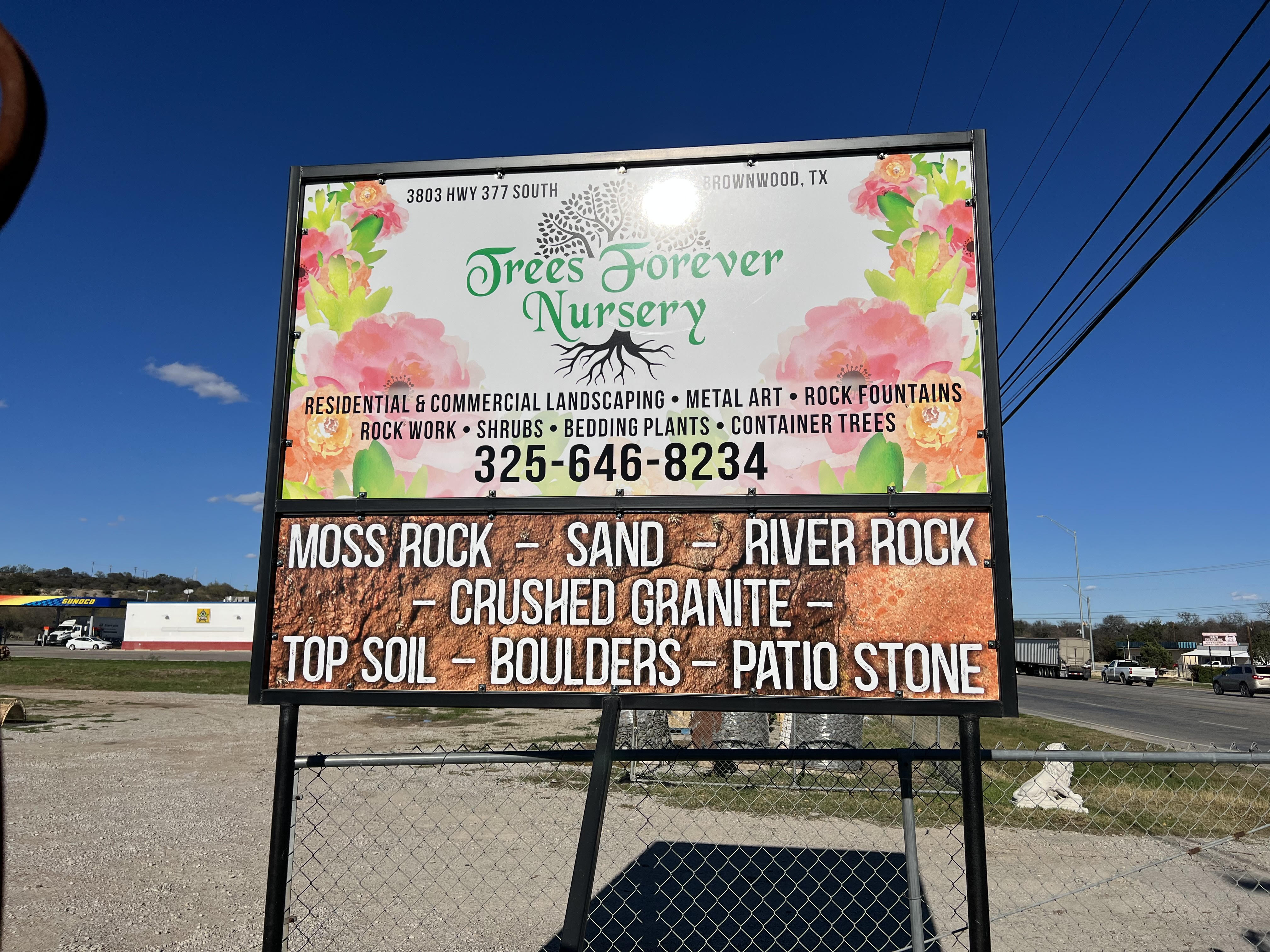 The Trees Forever Nursery roadside sign at 3803 US-377 South in Brownwood, TX, listing rock, soil, and landscaping services
